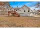 Back of the house with a deck, a staircase, and a spacious backyard ready for entertaining at 182 Noah Dr, Rockmart, GA 30153