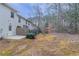 Exterior view of backyard featuring the back of the home and partial fence at 2890 Ridgeview Sw Dr, Atlanta, GA 30331