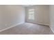 Simple bedroom has carpet, neutral colored walls, and a window providing natural light at 2890 Ridgeview Sw Dr, Atlanta, GA 30331