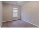 Small bedroom with neutral walls, carpet, and a window providing natural light at 2890 Ridgeview Sw Dr, Atlanta, GA 30331