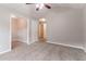 Bedroom with neutral walls and carpet leads to doorway to additional bedrooms and closets at 2890 Ridgeview Sw Dr, Atlanta, GA 30331