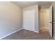 Bedroom with neutral walls and carpet features closet and doorway to other rooms at 2890 Ridgeview Sw Dr, Atlanta, GA 30331