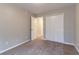 Bedroom with neutral walls and carpet features closet and doorway to other rooms at 2890 Ridgeview Sw Dr, Atlanta, GA 30331