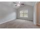 Bright bedroom features neutral walls, carpet, vaulted ceiling, and a ceiling fan at 2890 Ridgeview Sw Dr, Atlanta, GA 30331