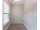 Small bedroom features neutral walls, carpet, and a window for natural light at 2890 Ridgeview Sw Dr, Atlanta, GA 30331