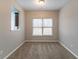 Dining room with a large window overlooking the backyard, neutral paint, and carpeted floors at 2890 Ridgeview Sw Dr, Atlanta, GA 30331