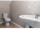 Half bath featuring a toilet and decorative sink at 2890 Ridgeview Sw Dr, Atlanta, GA 30331