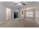 Spacious living room area filled with light, neutral paint, and plush carpeting at 2890 Ridgeview Sw Dr, Atlanta, GA 30331