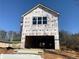 New two-story home under construction with siding, garage, and bright windows at 4862 Campbell Dr, Atlanta, GA 30349