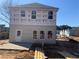 New two-story home featuring gray siding, a rear entrance, and bright windows at 4862 Campbell Dr, Atlanta, GA 30349