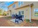 The backyard of the townhome features a patio and grill at 6880 Robinson St, Lithonia, GA 30058