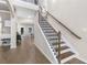 Spacious foyer with hardwood floors and elegant staircase at 117 Pacific Ave, Sharpsburg, GA 30277