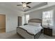 Spacious bedroom featuring a tray ceiling and ample natural light at 1258 Ainsworth Aly # 46, Sugar Hill, GA 30518