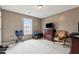 Bedroom with space for a TV and chairs creating a bright and airy atmosphere for relaxation and personalization at 14 Edith Ln, Douglasville, GA 30134