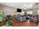 Inviting living room with hardwood floors, plush sofas, and a fireplace providing a comfortable space for relaxation and gatherings at 14 Edith Ln, Douglasville, GA 30134