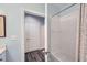 Bathroom featuring a shower/tub combo with a modern shower curtain and access to a hallway at 2626 Peachtree Nw Rd # 804, Atlanta, GA 30305