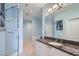 Bathroom with a granite countertop, white cabinets, a soaking tub, and a glass-enclosed shower at 2626 Peachtree Nw Rd # 804, Atlanta, GA 30305