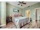 Bedroom featuring light green walls, wood floors, a queen bed, and access to the bathroom through a doorway at 2626 Peachtree Nw Rd # 804, Atlanta, GA 30305