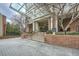 Grand entrance to a brick building with covered drop-off area and well-maintained landscaping at 2626 Peachtree Nw Rd # 804, Atlanta, GA 30305