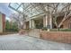 Building entrance with brick facade, glass doors, and a covered walkway at 2626 Peachtree Nw Rd # 804, Atlanta, GA 30305