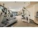 Large gym space featuring multiple treadmills, weight machines, and mirrored walls for a comprehensive workout experience at 2626 Peachtree Nw Rd # 804, Atlanta, GA 30305