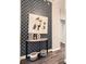 Stylish foyer area featuring hardwood floors, decorative wallpaper, and a modern console table at 2626 Peachtree Nw Rd # 804, Atlanta, GA 30305