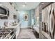 Well-equipped kitchen with stainless steel appliances, light gray cabinets, and stylish backsplash at 2626 Peachtree Nw Rd # 804, Atlanta, GA 30305