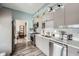 Kitchen featuring stainless steel appliances, light blue walls, and light gray cabinets at 2626 Peachtree Nw Rd # 804, Atlanta, GA 30305