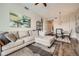 Open-concept living room with a sectional sofa, wood-look flooring, and a dining area at 2626 Peachtree Nw Rd # 804, Atlanta, GA 30305