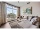 Inviting living room with a comfortable sectional sofa, large windows, and wood-look flooring at 2626 Peachtree Nw Rd # 804, Atlanta, GA 30305
