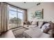 Living room featuring large windows with a sliding glass door and comfortable seating at 2626 Peachtree Nw Rd # 804, Atlanta, GA 30305