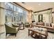 Beautifully lit lounge area with large windows, comfortable seating, and stylish decor and with views of the landscape at 2626 Peachtree Nw Rd # 804, Atlanta, GA 30305