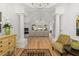 Spacious entry hall showcasing hardwood floors and an open floor plan to the living room at 6995 Polo Fields Pkwy, Cumming, GA 30040