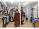 Spacious walk-in closet with ample storage and well-organized shelves at 6995 Polo Fields Pkwy, Cumming, GA 30040