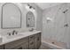 Modern bathroom with double vanity, sleek countertops, and a stylish walk-in shower with pebble flooring at 129 Old Alabama Se Rd, Emerson, GA 30137