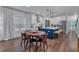 Bright kitchen with stainless steel appliances, white cabinets, a center island, and wood flooring at 129 Old Alabama Se Rd, Emerson, GA 30137