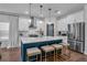 Well-designed kitchen featuring a large island with seating, stainless steel appliances, and white cabinetry at 129 Old Alabama Se Rd, Emerson, GA 30137