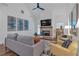 Inviting living room with a brick fireplace, ceiling fan, and stylish decor at 129 Old Alabama Se Rd, Emerson, GA 30137