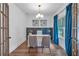 Bright office space with modern light fixture, stylish decor, and French doors at 129 Old Alabama Se Rd, Emerson, GA 30137