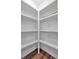 Walk-in pantry featuring wood-look floors and ample shelving for organized storage at 129 Old Alabama Se Rd, Emerson, GA 30137