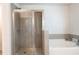 Contemporary bathroom features a glass shower and separate soaking tub at 2882 Cadence Walk Rd, Atlanta, GA 30360