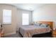 Bedroom features carpeted floors, natural light from the window, and wood furniture at 2882 Cadence Walk Rd, Atlanta, GA 30360