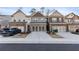 Charming townhomes featuring brick accents, neutral exteriors and two car garages at 2882 Cadence Walk Rd, Atlanta, GA 30360