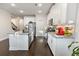 Modern kitchen featuring white cabinets, granite countertops, and stainless steel appliances at 2882 Cadence Walk Rd, Atlanta, GA 30360