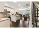 Open-concept kitchen with granite countertops, stainless appliances, and a view of the living area at 2882 Cadence Walk Rd, Atlanta, GA 30360