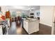 Kitchen island featuring a double sink and a breakfast bar, perfect for entertaining at 2882 Cadence Walk Rd, Atlanta, GA 30360