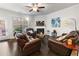 Cozy living room with a fireplace, comfortable seating, and natural light at 2882 Cadence Walk Rd, Atlanta, GA 30360