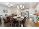 Open concept living space featuring a dining area, kitchen and hardwood flooring at 2882 Cadence Walk Rd, Atlanta, GA 30360