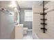 Bathroom with a shower/tub combination, white tile, and modern fixtures at 3344 Dogwood Dr, Atlanta, GA 30354