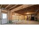 Large unfinished basement area with wooden framework and door leading to the outside at 3750 Montebello Pkwy, Cumming, GA 30028